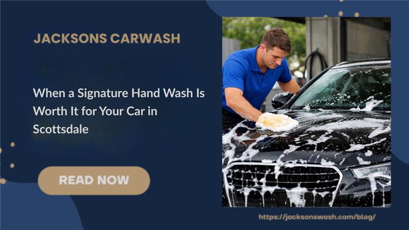 an employee hand washing a luxury vehicle