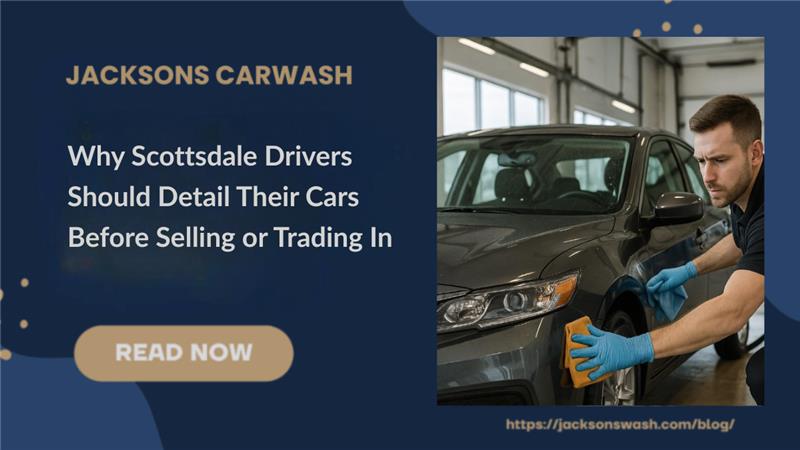 A person wiping down a car